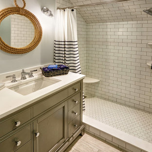 Bathroom - mid-sized coastal kids' white tile and ceramic tile ceramic tile, multicolored floor, single-sink, wallpaper ceiling and wallpaper bathroom idea in Other with beaded inset cabinets, gray cabinets, a wall-mount toilet, gray walls, an undermount sink, quartzite countertops, white countertops and a freestanding vanity