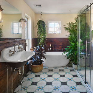 Inspiration for a large eclectic master cement tile floor and wainscoting bathroom remodel in Philadelphia with a wall-mount sink