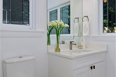 Mid-sized transitional master bathroom photo in Seattle with white walls