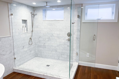 Large arts and crafts master white tile and marble tile vinyl floor, brown floor and double-sink bathroom photo in Seattle with shaker cabinets, white cabinets, a two-piece toilet, beige walls, an undermount sink, quartz countertops, a hinged shower door, pink countertops and a built-in vanity