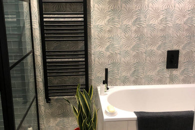 Inspiration for a medium sized eclectic ensuite bathroom in Berkshire with a floating vanity unit, medium wood cabinets, a built-in bath, a corner shower, a wall mounted toilet, multi-coloured tiles, porcelain tiles, multi-coloured walls, porcelain flooring, an integrated sink, beige floors, a hinged door and a single sink.