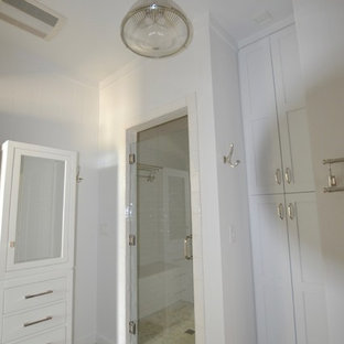 Mid-sized minimalist 3/4 white tile and porcelain tile concrete floor, gray floor, single-sink, shiplap ceiling and shiplap wall bathroom photo in Austin with shaker cabinets, white cabinets, a two-piece toilet, white walls, an undermount sink, granite countertops, a hinged shower door, brown countertops and a built-in vanity