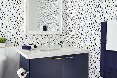 Bathroom - modern bathroom idea in Toronto with blue cabinets and quartzite countertops