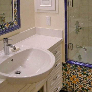 Majolica tile and a semi-recessed sink.