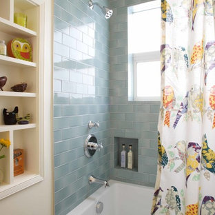 Photo of a shabby-chic style bathroom in Los Angeles with an alcove tub, a shower/bathtub combo, blue tile and subway tile.
