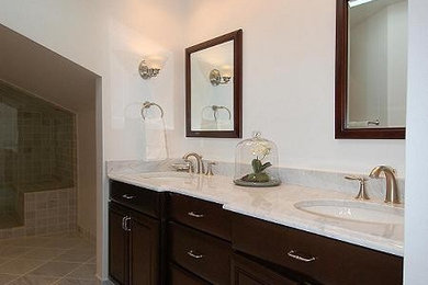 Example of a mid-sized transitional kids' white tile and stone tile marble floor bathroom design in DC Metro with an undermount sink, recessed-panel cabinets, dark wood cabinets, marble countertops, a two-piece toilet and white walls