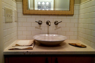Example of a minimalist bathroom design in New York with a vessel sink