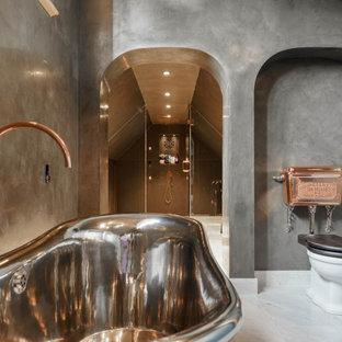 Expansive contemporary ensuite bathroom in Oxfordshire with a freestanding bath, an alcove shower, a two-piece toilet, grey walls, white floors and a hinged door.