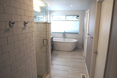 Example of a trendy master porcelain tile porcelain tile bathroom design in Seattle with shaker cabinets, an undermount sink and quartz countertops