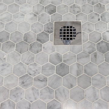 Marbe hexagon mosaic tiles on the shower floor