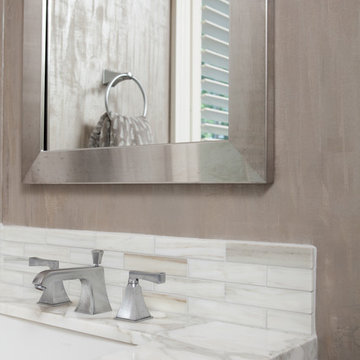 Marble Countertop in Bathroom with Silver Framed Mirror