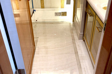 Inspiration for a marble tile marble floor alcove shower remodel in New York with marble countertops