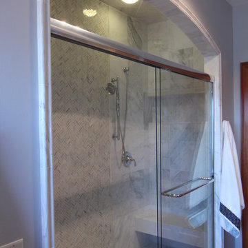 Marble tile border around sliding shower doors