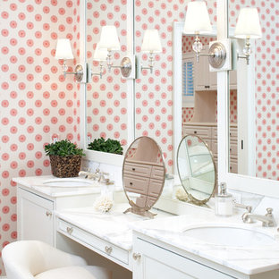 Example of a large beach style master stone tile bathroom design in Boston with marble countertops, an undermount sink, recessed-panel cabinets, white cabinets and pink walls