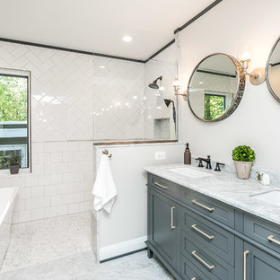 Bathroom - transitional master white tile and subway tile marble floor and gray floor bathroom idea in Baltimore with shaker cabinets, gray cabinets, white walls, marble countertops, an undermount sink and gray countertops