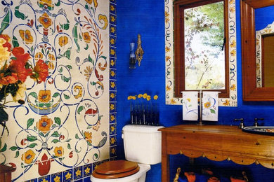 Bathroom - eclectic multicolored tile bathroom idea in San Francisco with a drop-in sink, open cabinets and medium tone wood cabinets