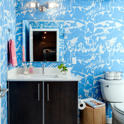 Example of an eclectic bathroom design in Los Angeles with an undermount sink, flat-panel cabinets and dark wood cabinets