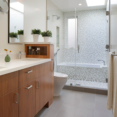 Inspiration for a contemporary white tile and mosaic tile bathroom remodel in San Francisco with flat-panel cabinets, medium tone wood cabinets and quartz countertops