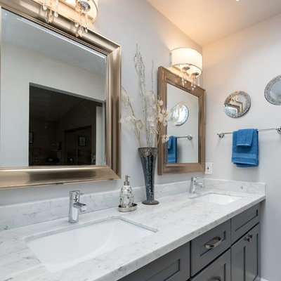 Inspiration for a large transitional master white tile and marble tile travertine floor and beige floor bathroom remodel in Other with shaker cabinets, gray cabinets, a two-piece toilet, beige walls, an undermount sink, quartzite countertops and white countertops