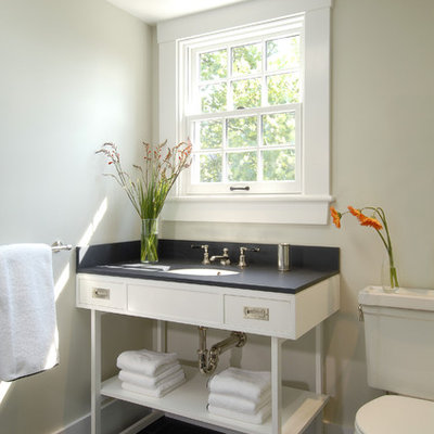 Trendy black tile bathroom photo in Boston with an undermount sink, open cabinets and white cabinets