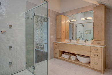 Inspiration for a mid-sized contemporary master white tile and porcelain tile bathroom remodel in New York with flat-panel cabinets, light wood cabinets, beige walls, an undermount sink and a hinged shower door