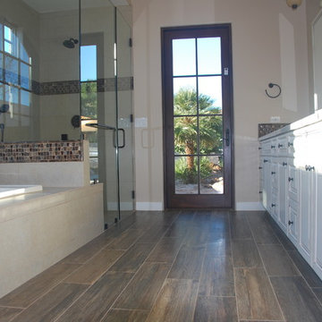 Master Bath Adorned with Decorative Mosaic Tiles, Granite Tops Expansive Walk in