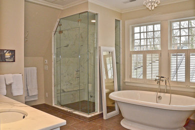 Photo of a medium sized classic ensuite bathroom in Orange County with a freestanding bath, an alcove shower, grey tiles, white tiles, stone slabs, beige walls, ceramic flooring, a submerged sink, soapstone worktops, brown floors and a hinged door.