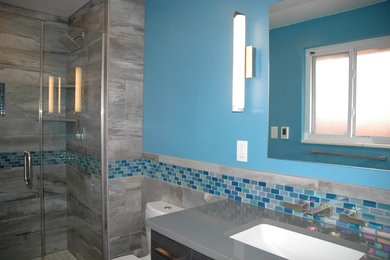 Example of a small trendy master blue tile and ceramic tile ceramic tile bathroom design in Denver with an undermount sink, blue walls, quartz countertops and a two-piece toilet