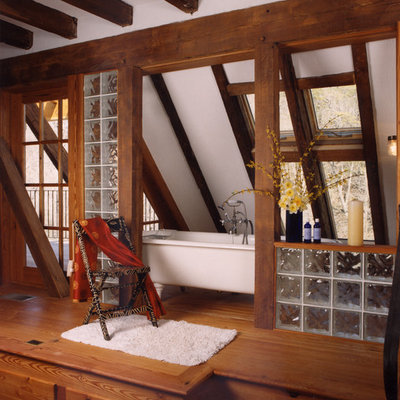 Inspiration for a rustic master medium tone wood floor freestanding bathtub remodel in Richmond