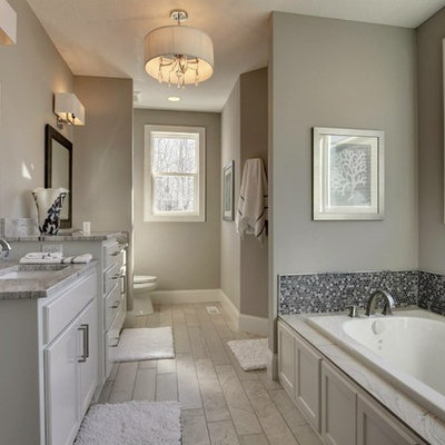 Large transitional master black tile, gray tile, white tile and mosaic tile porcelain tile bathroom photo in Minneapolis with shaker cabinets, white cabinets, a one-piece toilet, gray walls, an undermount sink and granite countertops