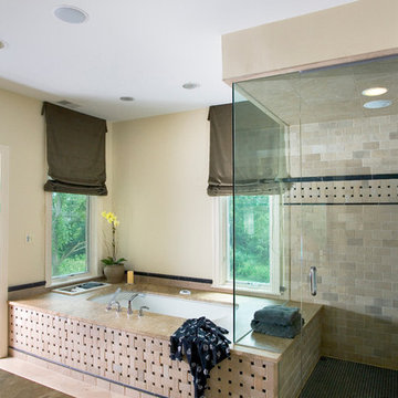 Master Bath Features Tumbled Dourdan Stone Tile and Black Glossy Marble Liner
