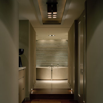 Inspiration for a contemporary limestone tile freestanding bathtub remodel in Seattle