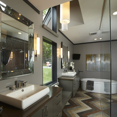Freestanding bathtub - contemporary freestanding bathtub idea in Minneapolis with a vessel sink
