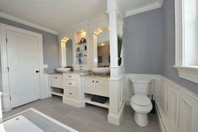 Transitional master gray tile and porcelain tile porcelain tile bathroom photo in New York with beaded inset cabinets, white cabinets, a two-piece toilet, gray walls, a vessel sink and granite countertops