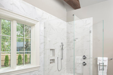 На фото: главная ванная комната с отдельно стоящей ванной, белой плиткой, мраморной плиткой, полом из керамической плитки, мраморной столешницей и душем с распашными дверями с