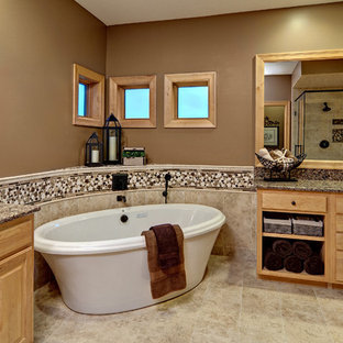 Inspiration for a contemporary freestanding bathtub remodel in Minneapolis with granite countertops