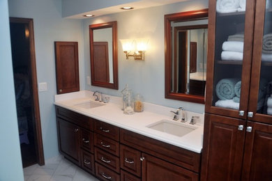 Inspiration for a large transitional master white tile and ceramic tile porcelain tile bathroom remodel in Atlanta with blue walls, an undermount sink, furniture-like cabinets, dark wood cabinets and quartz countertops