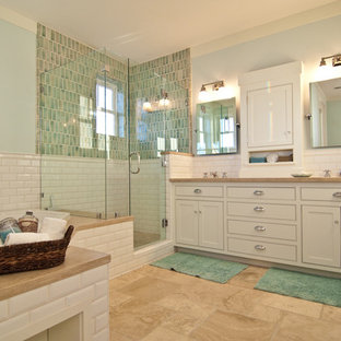 Beach style ceramic tile alcove shower photo in Orange County