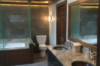 Inspiration for a large rustic master green tile and ceramic tile ceramic tile walk-in shower remodel in Boston with furniture-like cabinets, gray cabinets, an undermount tub, a two-piece toilet, green walls, an undermount sink and granite countertops