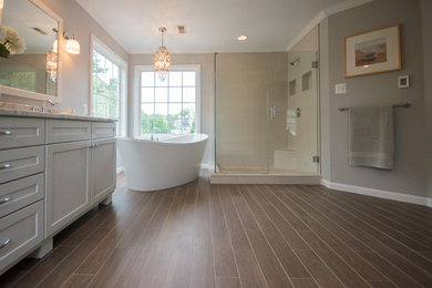 Example of a mid-sized trendy master brown tile and porcelain tile porcelain tile bathroom design in Baltimore with recessed-panel cabinets, white cabinets, an undermount sink and quartzite countertops