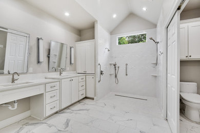 Large elegant master white tile and subway tile porcelain tile and multicolored floor bathroom photo in New Orleans with shaker cabinets, white cabinets, a two-piece toilet, gray walls, an undermount sink, quartzite countertops and white countertops