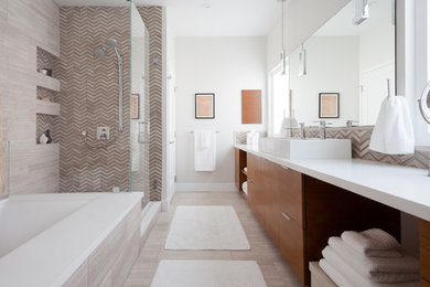 Bathroom - mid-sized contemporary master gray tile travertine floor bathroom idea in Los Angeles with flat-panel cabinets, medium tone wood cabinets, an undermount tub, white walls, a vessel sink and quartz countertops