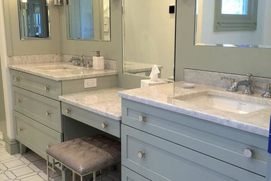 Example of a mid-sized classic master white tile and marble tile marble floor and white floor walk-in shower design in Boston with furniture-like cabinets, green cabinets, a one-piece toilet, white walls, an undermount sink, marble countertops and a hinged shower door