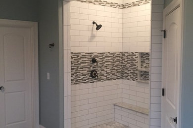 Inspiration for a mid-sized contemporary master black and white tile and glass tile porcelain tile and gray floor bathroom remodel in Indianapolis with white walls