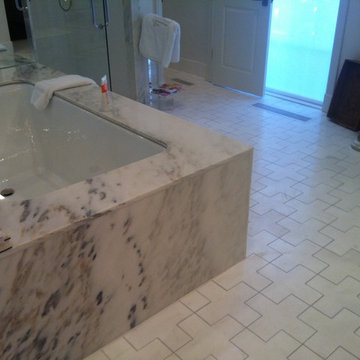 Master bath renovation with hand-cut marble