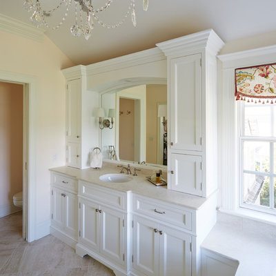 Inspiration for a shabby-chic style bathroom remodel in Baltimore with an undermount sink, recessed-panel cabinets, white cabinets and beige walls