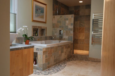 Inspiration for a contemporary master bathroom remodel in Dallas with a vessel sink and light wood cabinets