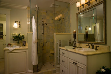 Design ideas for a medium sized classic ensuite bathroom in Denver with a built-in sink, freestanding cabinets, a walk-in shower, multi-coloured tiles, glass tiles, green walls, ceramic flooring and white cabinets.