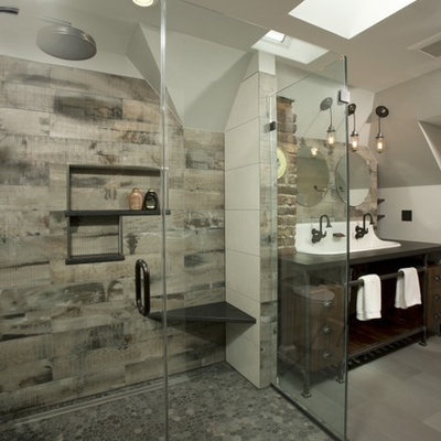 Doorless shower - large industrial master gray tile and porcelain tile porcelain tile and gray floor doorless shower idea in DC Metro with a trough sink, dark wood cabinets, solid surface countertops, gray walls, open cabinets, a two-piece toilet and a hinged shower door