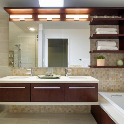 Bathroom - mid-sized modern master beige tile and porcelain tile porcelain tile and beige floor bathroom idea in New York with flat-panel cabinets, dark wood cabinets, a one-piece toilet, white walls, quartzite countertops, an undermount sink and a hinged shower door